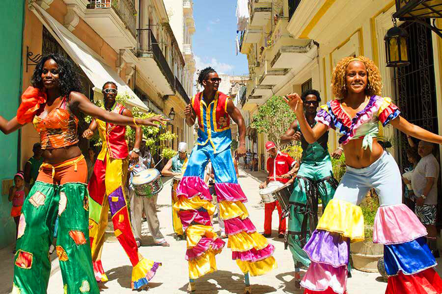 Cuban Salsa and Rumba dancers performing on vibrant stage